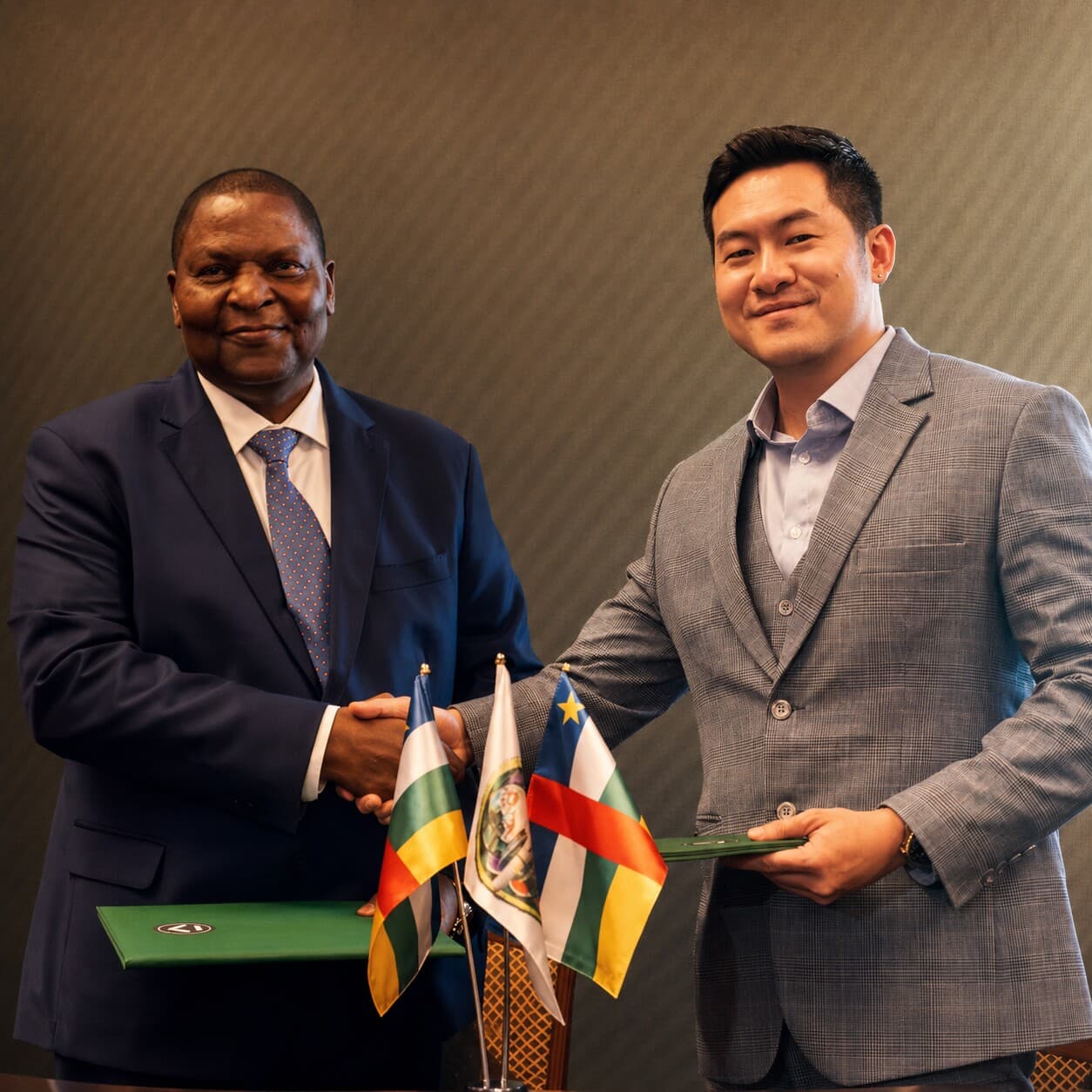 Jonathan Low shaking hands with the President of the Central African Republic at the Ampyre sovereign partnership signing ceremony
